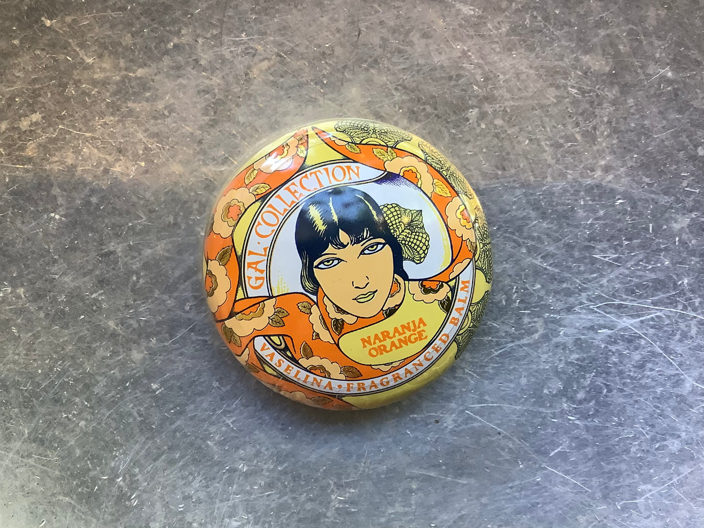 Orange container of lip balm
