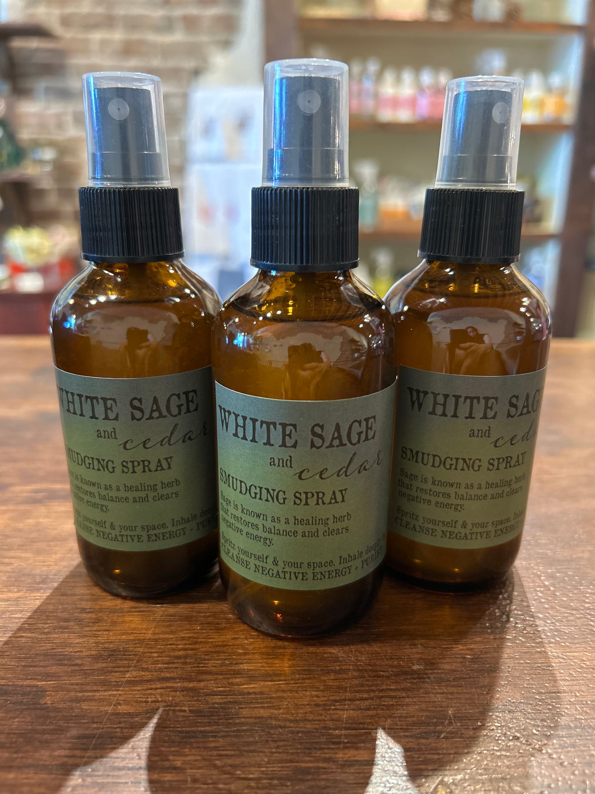 bottles of white sage and cedar spray