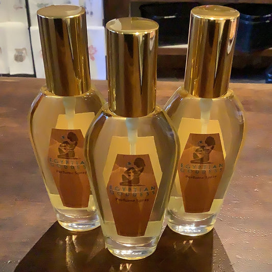 Bottle of perfume spray with a gold top