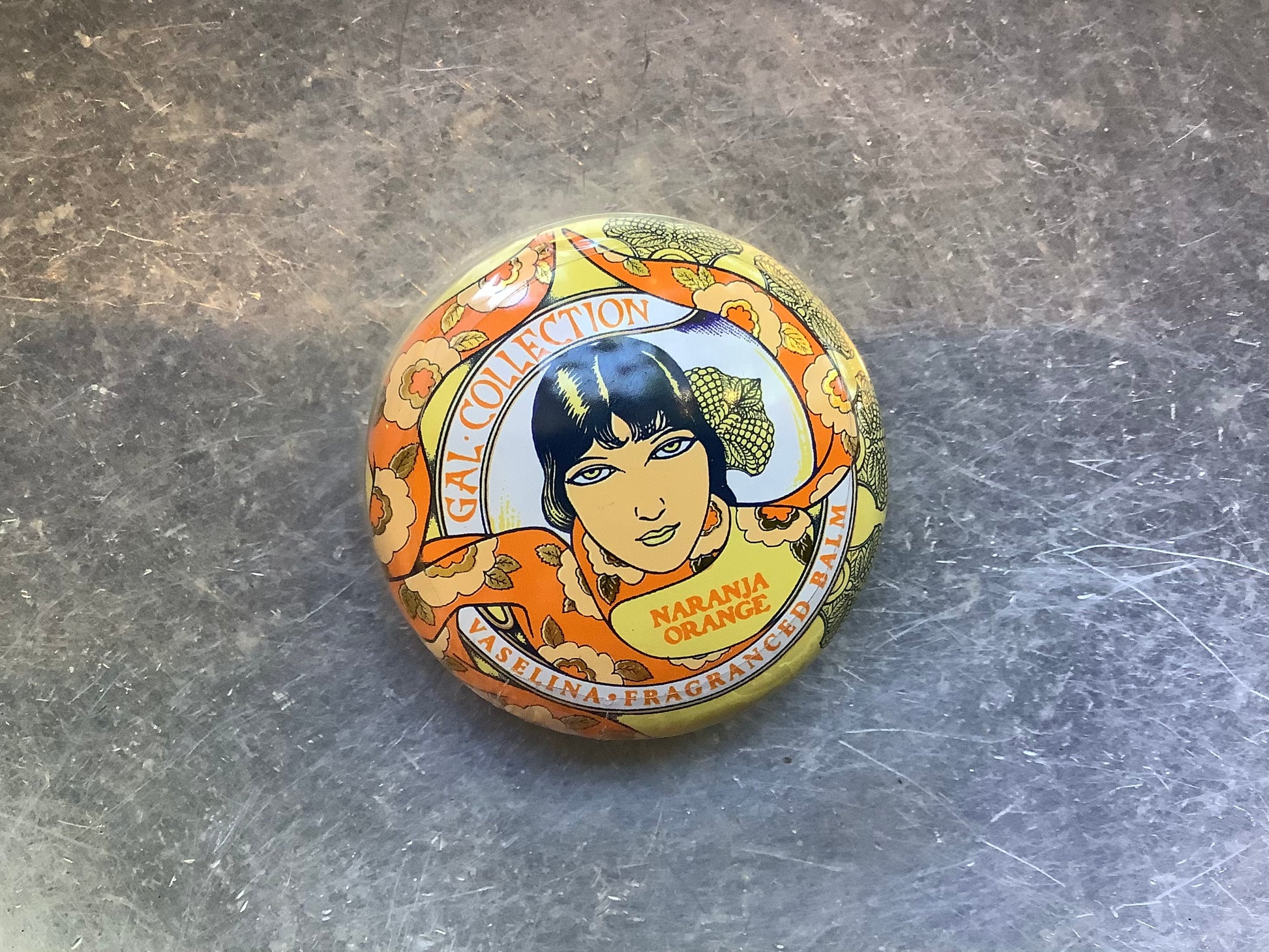 Orange container of lip balm 