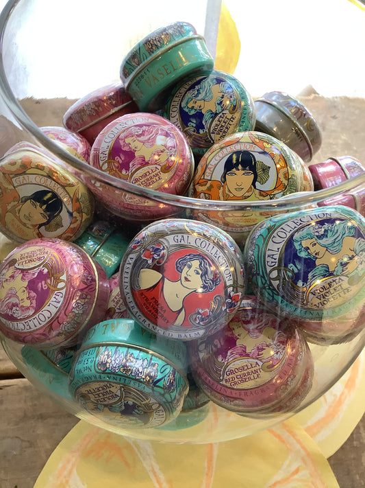 Bowl of containers of lip balm