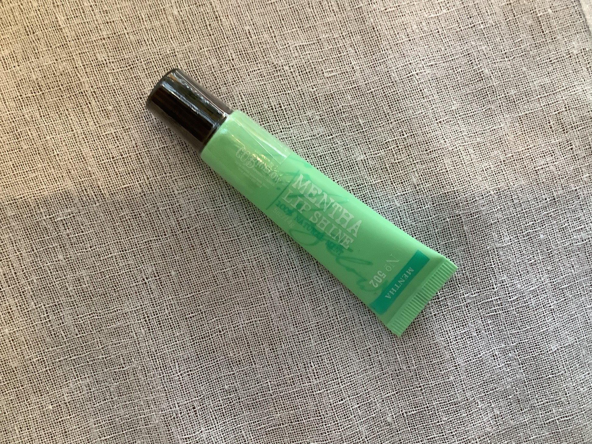 Green tube of C.O. Bigelow lip shine
