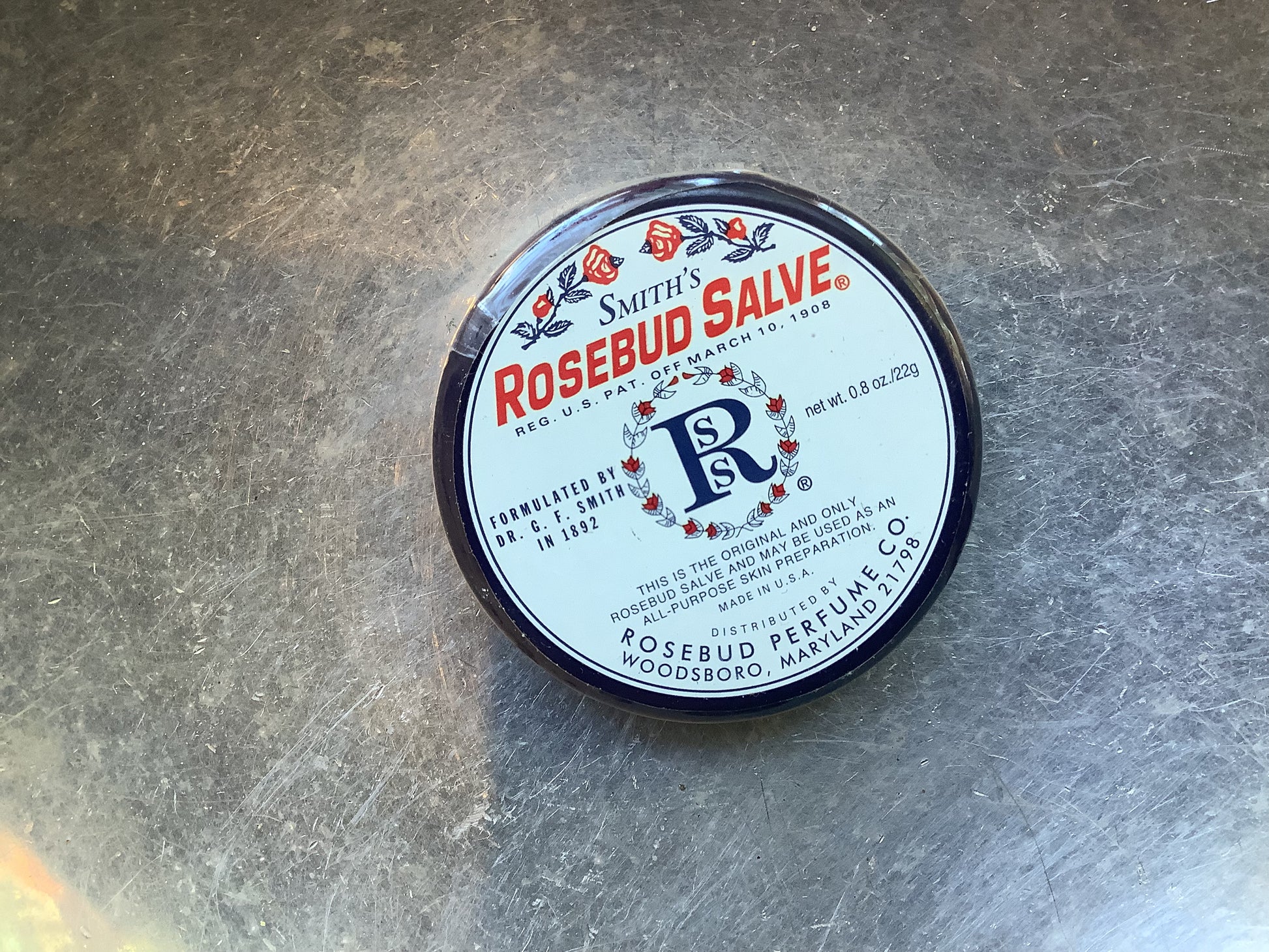 Container of Smith's rosebud salve lip balm