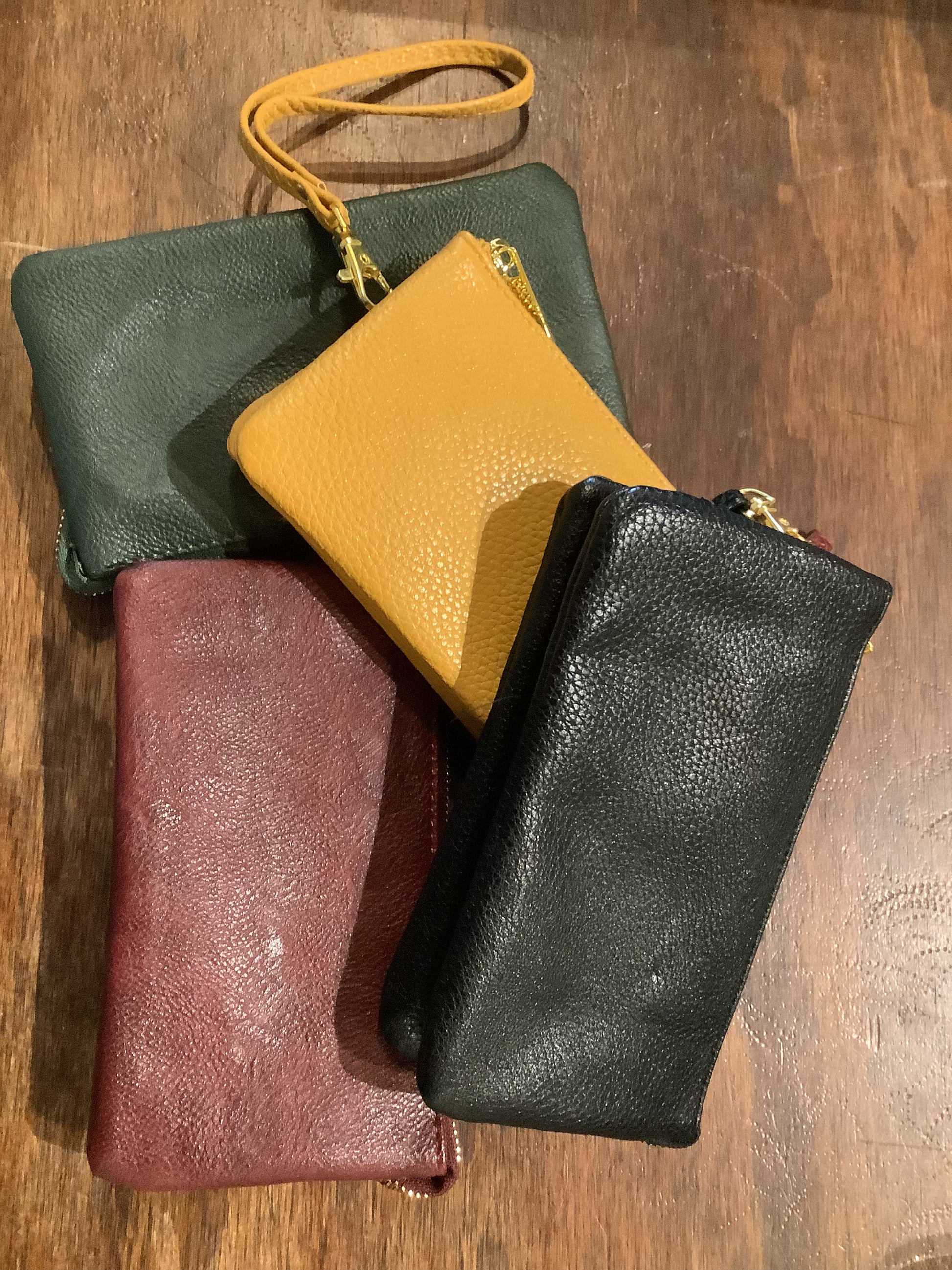 an assortment of women's wallets